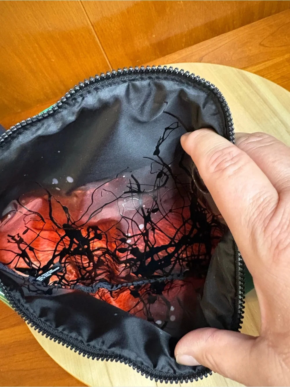 limited-edition MAC Cosmetics x Stranger Things Hawkins Tigers waist bag,